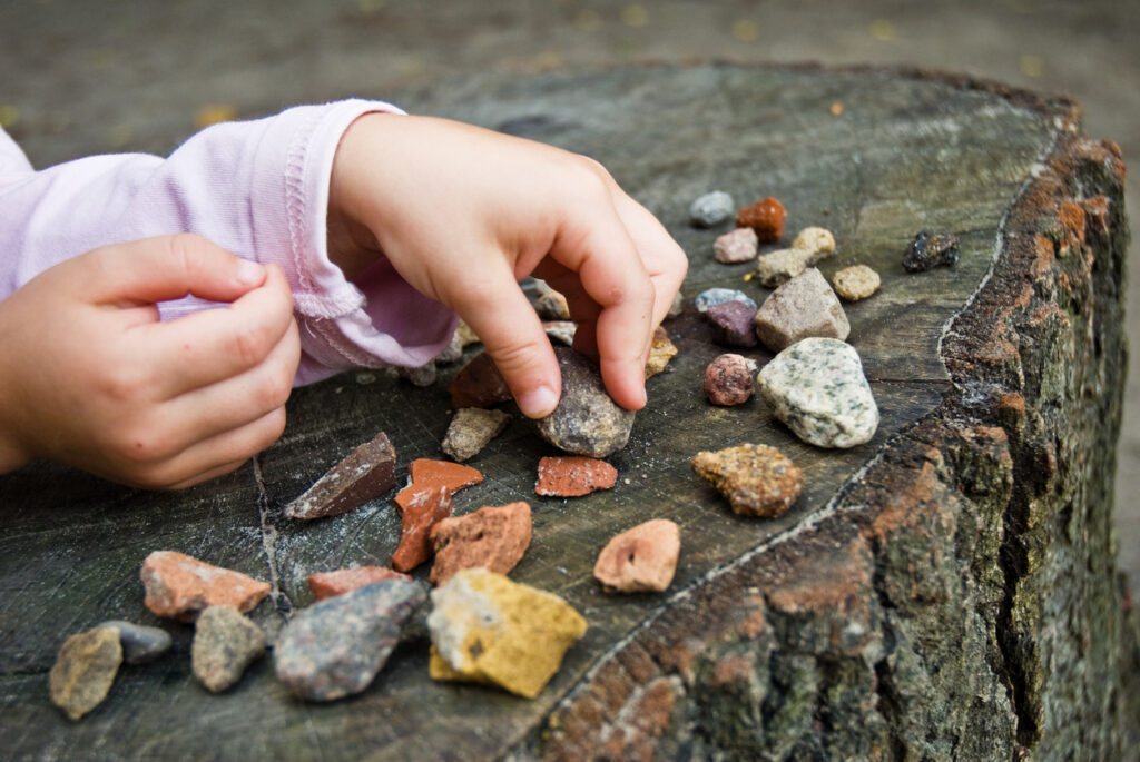 kid counting rocks
